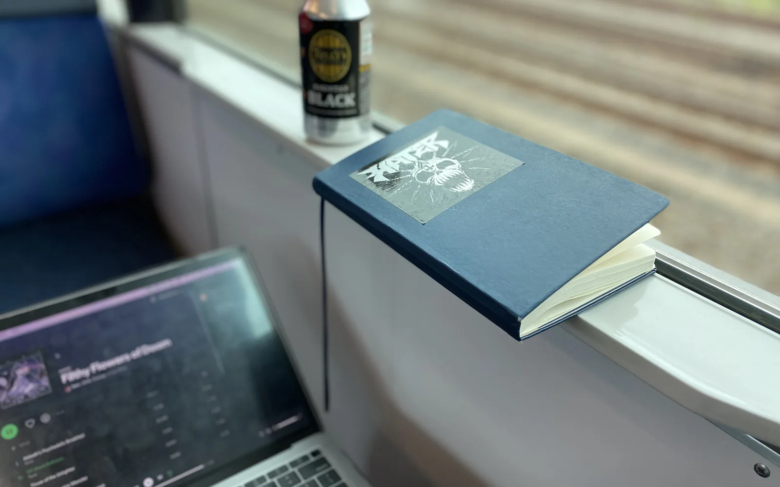 Laptop and notebook used for writing a technology decision memo and vendor recommendation