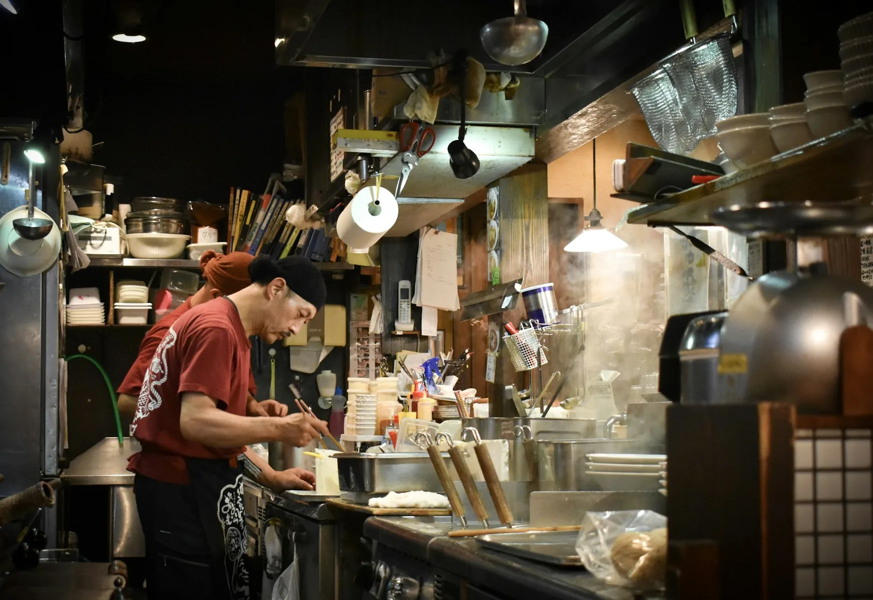Man cooking inside a kitchen in Japan