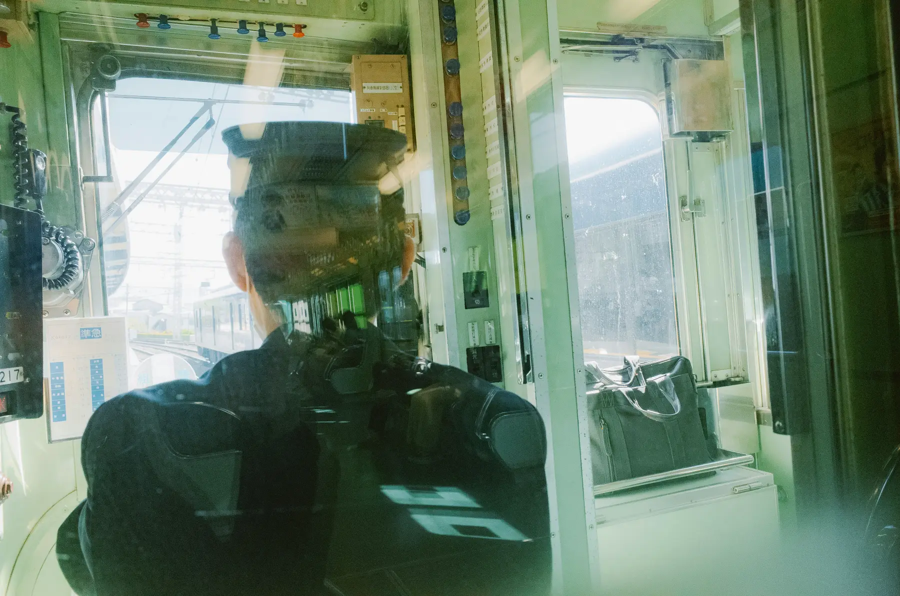 A ghostly legacy machine room representing fragile systems that keep operating after ownership disappears